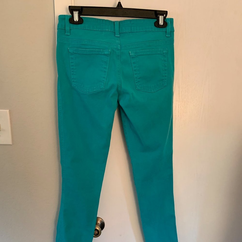Turquoise low rise skinny jeans